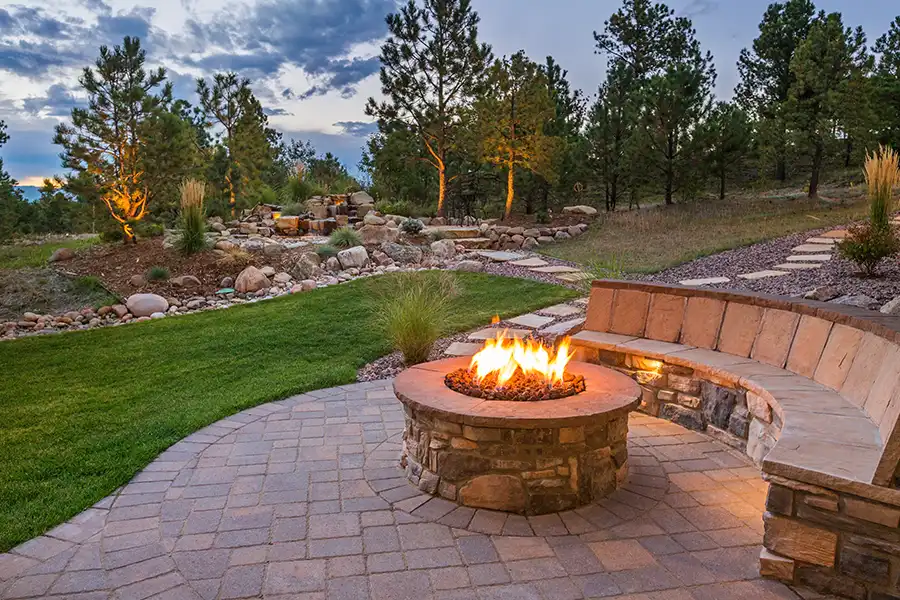 Taylormade Landworks—A fire pit built into the patio area in a yard in Springfield, IL.