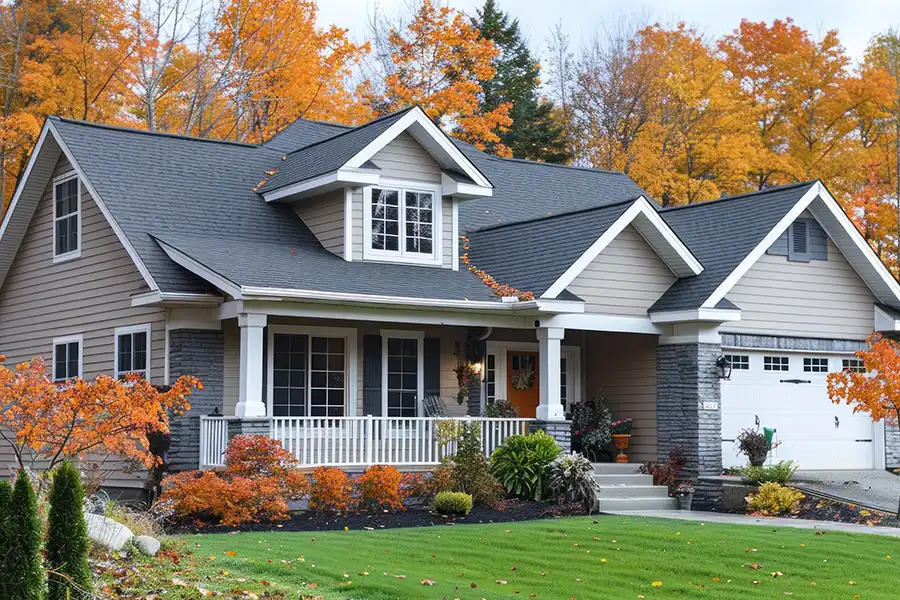 A home in Springfield, IL surrounded by a beautiful landscape filled with fall colors, including shades of orange, green, yellow, and red.